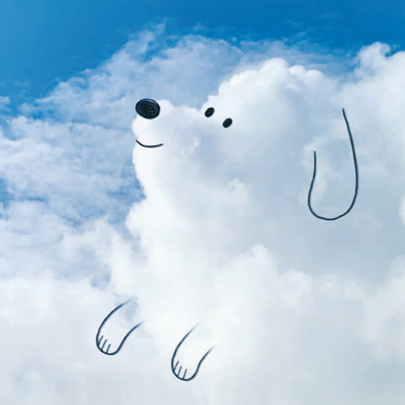 Dog made of clouds against a blue sky