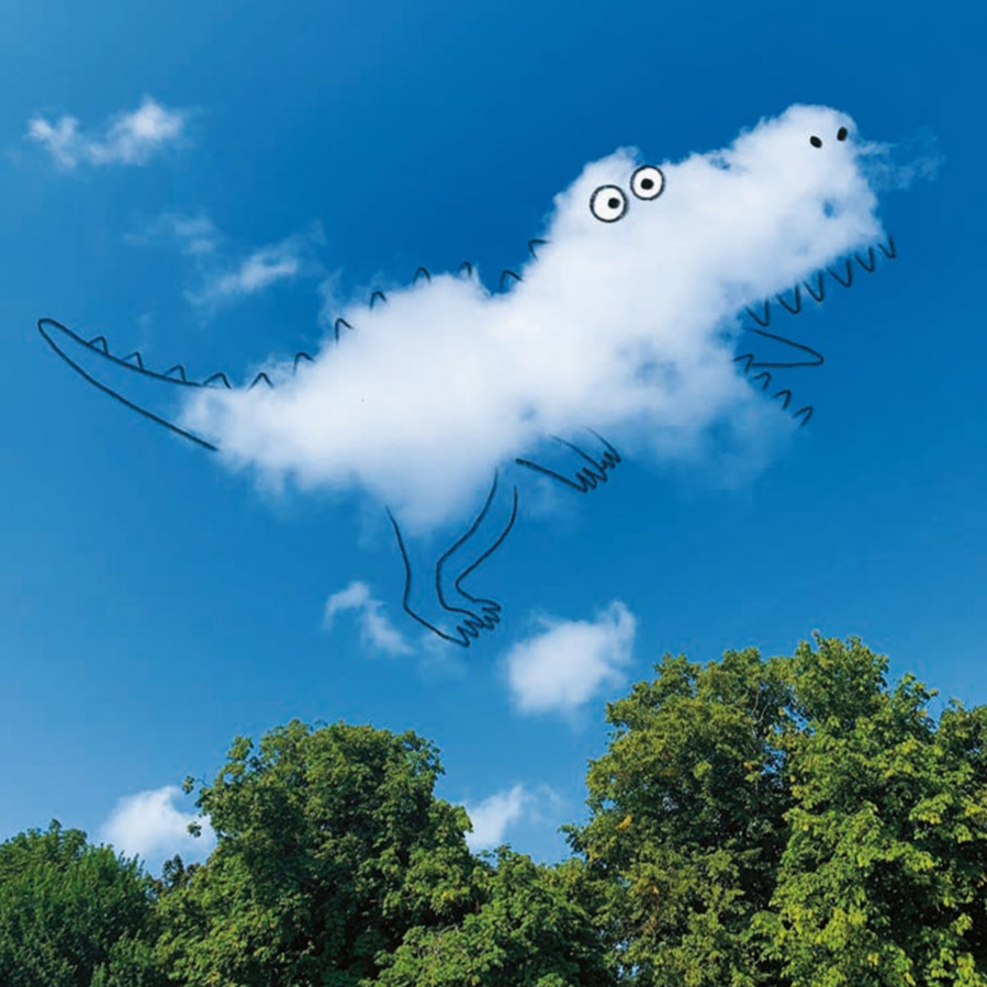 Cloud shaped like a dinosaur with eyes and mouth, against a blue sky with trees below.