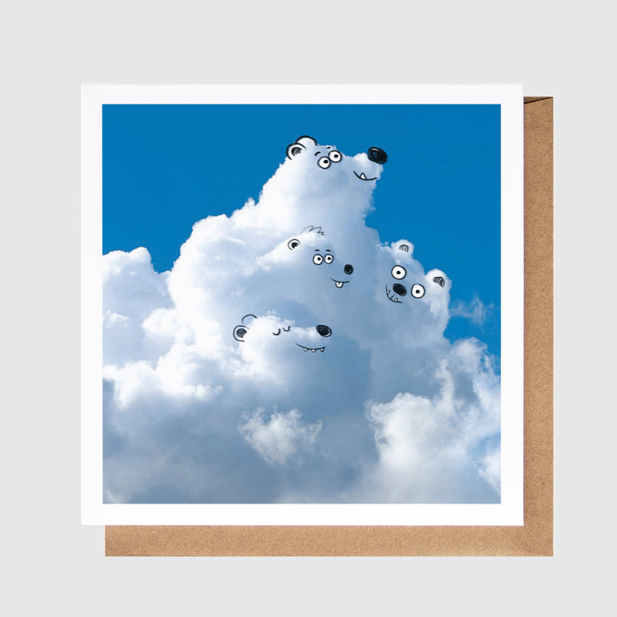 Cartoon polar bear with cloud-like body on a blue sky background