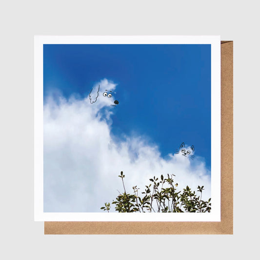 Card with a blue sky and cloud design, featuring a brown border.