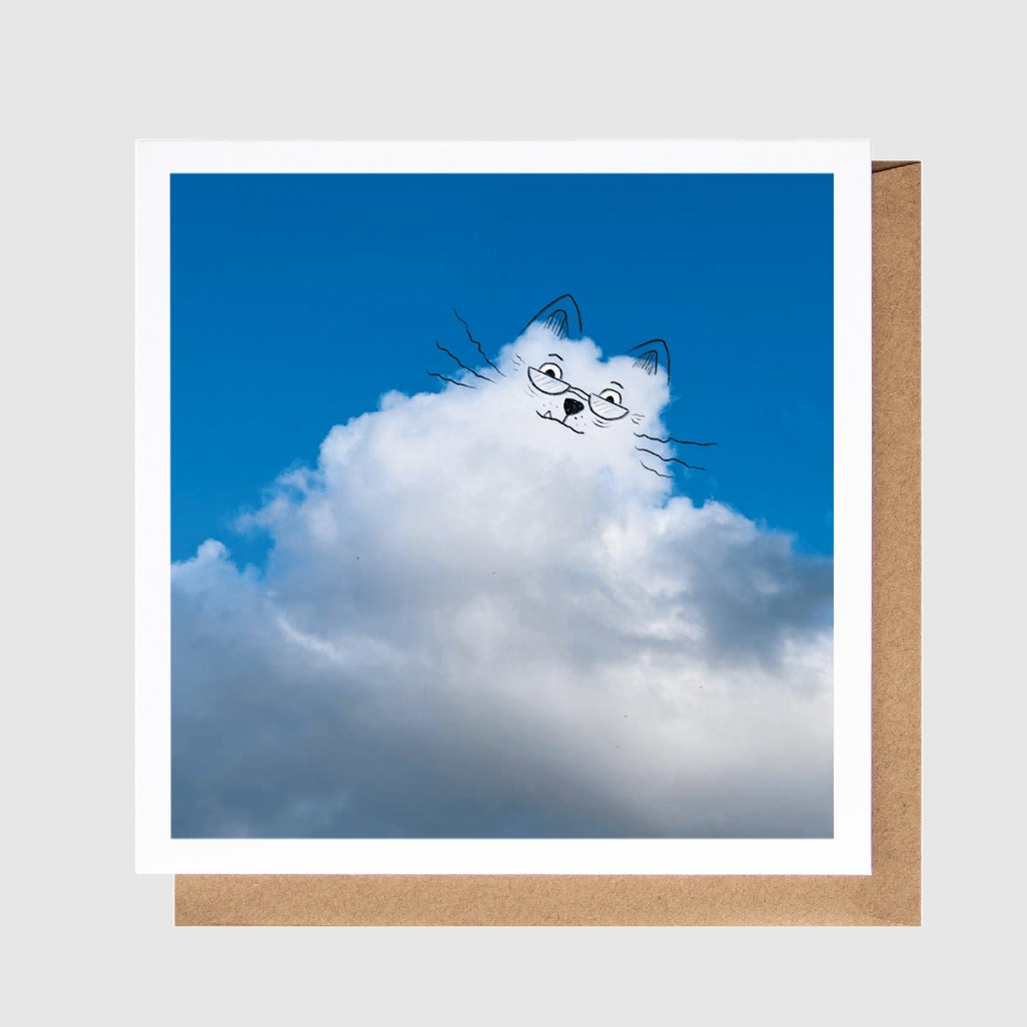 Card with a cat-shaped cloud design against a blue sky background