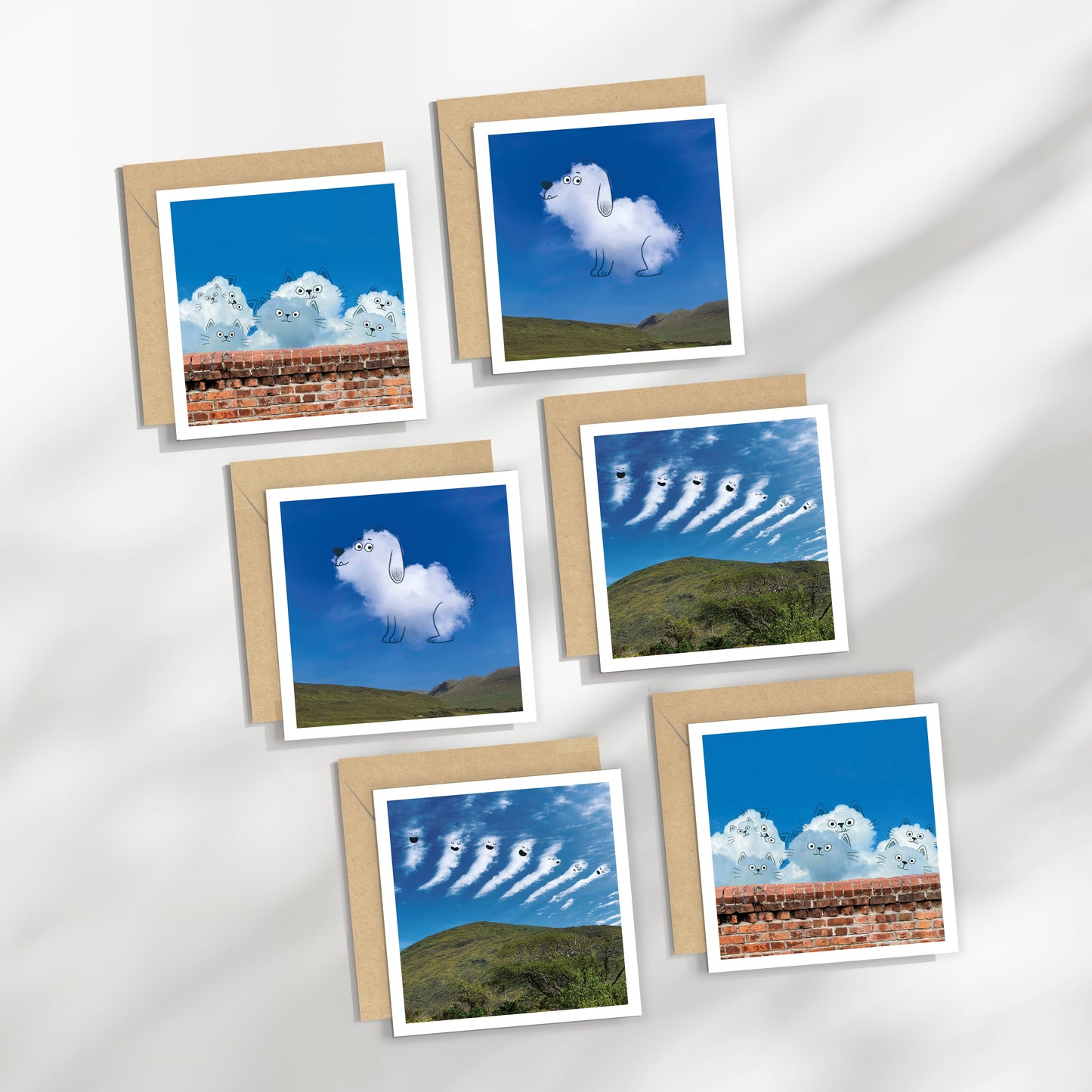 Set of six greeting cards with cloud-themed designs on a white background, cats and dogs.