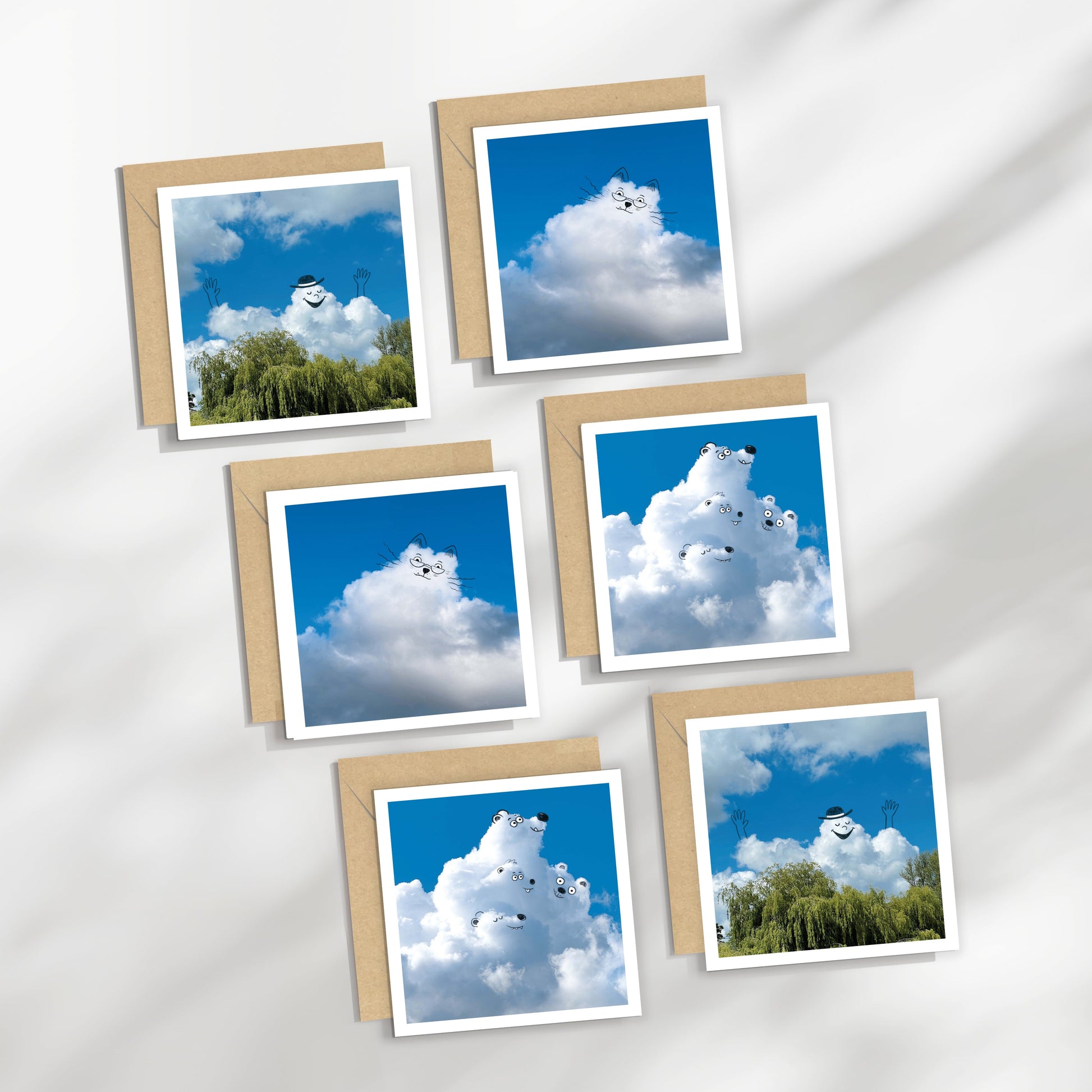 Set of greeting cards with cloud and nature designs on a white background